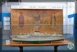 11 – Modello MN Giulio Cesare con sullo sfondo la pala d’altare della nave realizzata da Gianni Russian